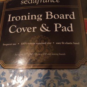 Brand New Ironing Board Cover. Blue/White pattern. Never been opened.